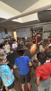 Wise Camps students watching an exciting supervised chemistry demonstration