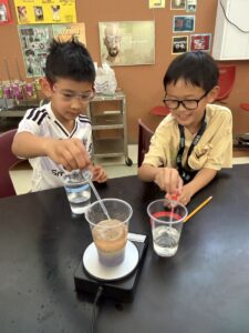 Wise Camps students working together on a colorful science experiment